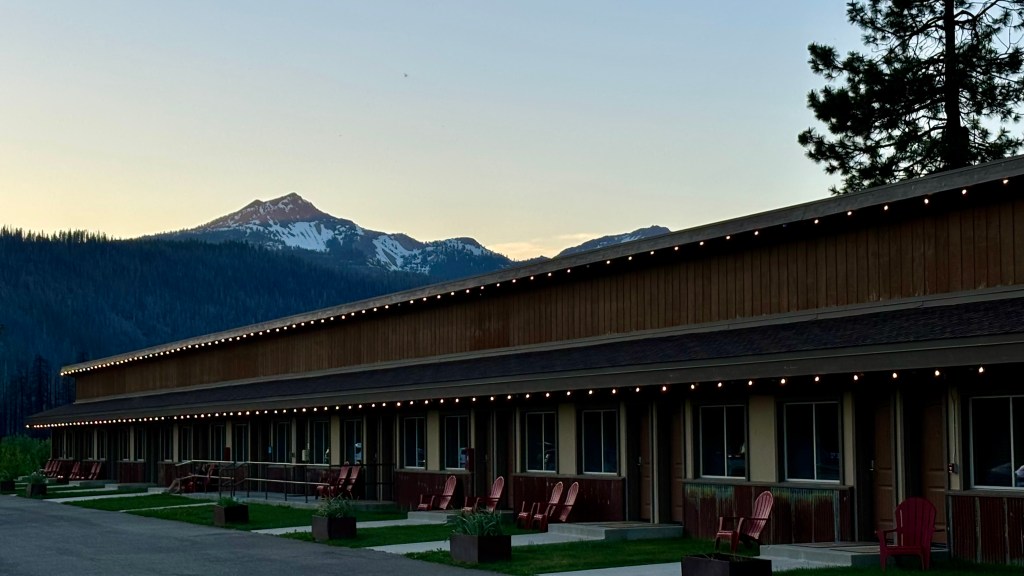 Highlands Inn motel rooms exterior with red adirondak chairs in front of each room