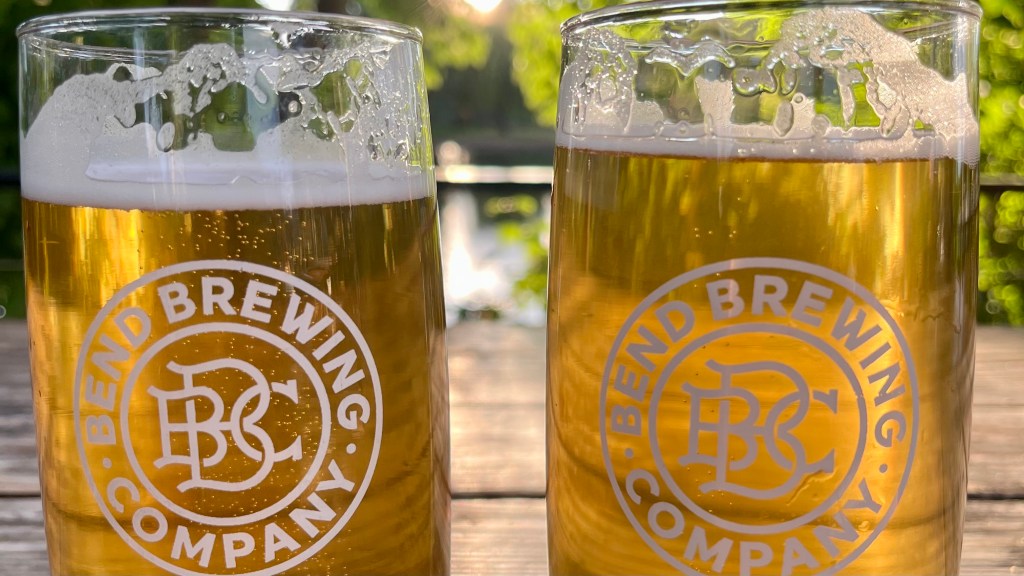 two glasses of beer with the Bend Brewing Company logo